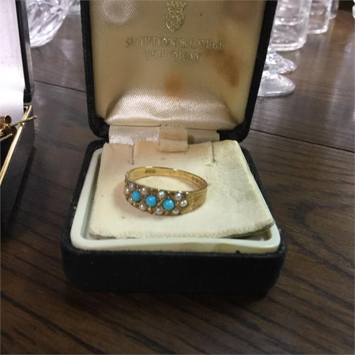 A Victorian pearl and turquoise ring set in gold.