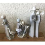 Lladro: A group of three figures.