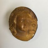 An unusual carved cameo in the form of a walnut.