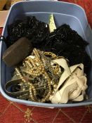 A box containing costume jewellery and beads.