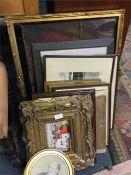 A quantity of gilt frames and pictures.