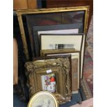 A quantity of gilt frames and pictures.