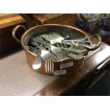 An old copper planter together with some cutlery e