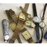 A group of modern gent's and ladies' wristwatches.