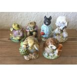 A group of six Beatrix Potter figures.