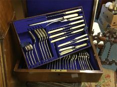 An oak cased cutlery service together with one oth