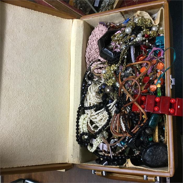 A large box of costume jewellery.