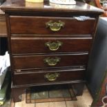 A four drawer stationery cabinet with brass handle