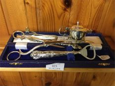 A silver cruet, bottle opener etc.