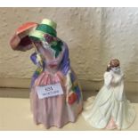A Royal Doulton figure of a lady together with one
