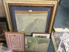 Old maps and framed and glazed pictures.