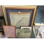 Old maps and framed and glazed pictures.