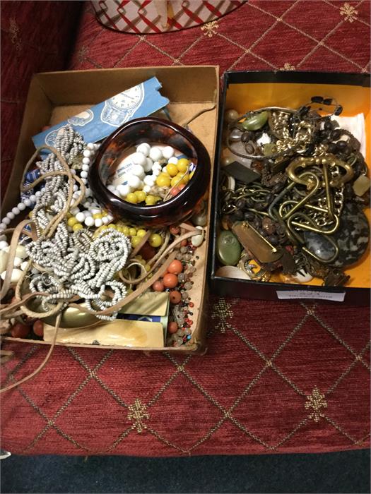 Two boxes of costume jewellery and beadworks.