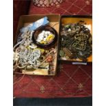 Two boxes of costume jewellery and beadworks.