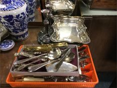 A collection of cutlery, candlesticks etc.