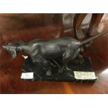 A good bronze of a hunting dog.