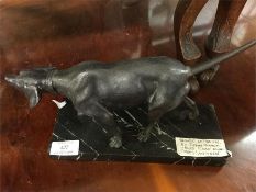 A good bronze of a hunting dog.