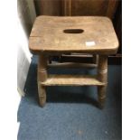 An old wooden kitchen stool.