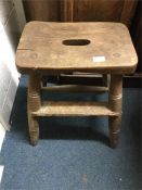 An old wooden kitchen stool.