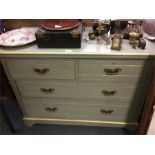 A painted chest of four drawers.