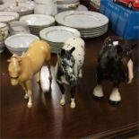 Two Royal Doulton figures of horses together with