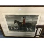 A large framed and glazed hunting scene.