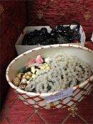 Two boxes of beads and other jewellery.