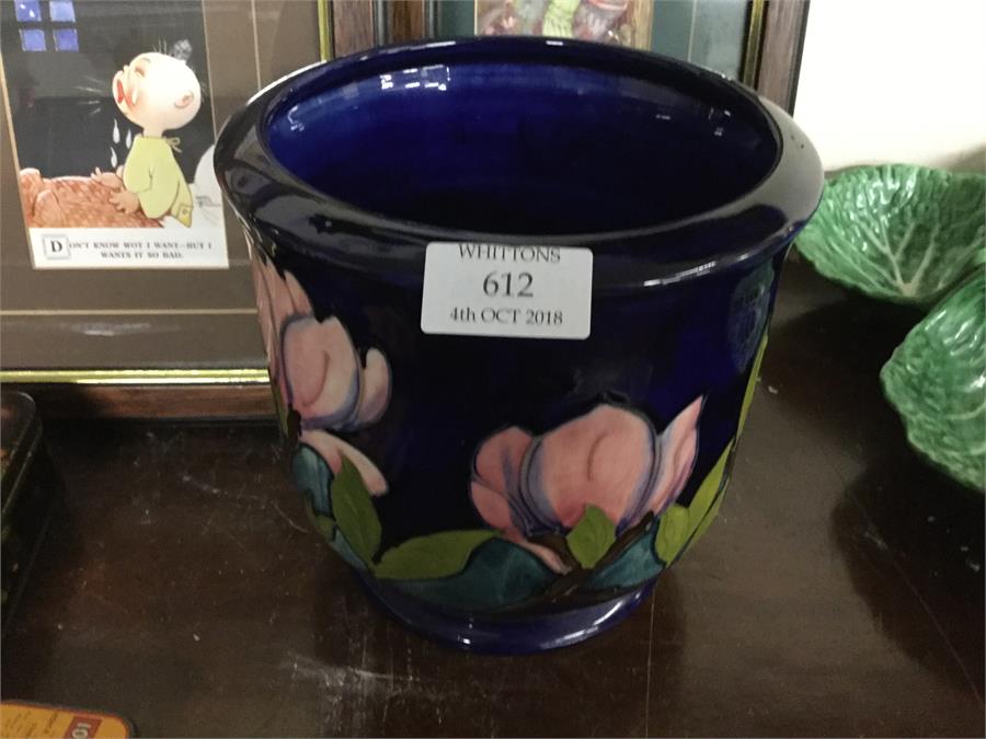 A Moorcroft blue ground jardiniere.