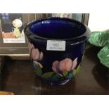 A Moorcroft blue ground jardiniere.