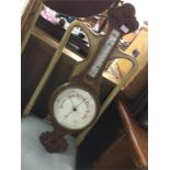 An oak carved banjo barometer.