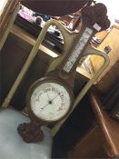 An oak carved banjo barometer.