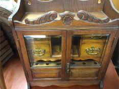 A good Edwardian oak smoker's cabinet.