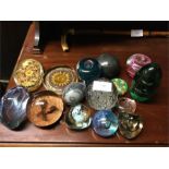 A quantity of good glass paperweights.