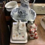 A decorative jug and basin set, Staffordshire dogs