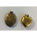 An attractive 15 carat oval locket with loop top t