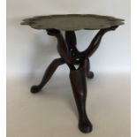A Continental brass mounted tripod table engraved