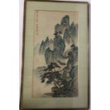 An Eastern framed and glazed painting with mountai