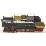 A box containing resin buildings, work sheds and b