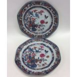 A pair of Antique Famille Rose plates decorated wi