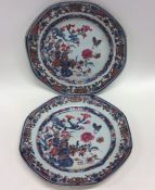 A pair of Antique Famille Rose plates decorated wi