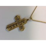 A 14 carat gold cross on matching fine link chain.