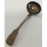 EXETER: A small silver fiddle pattern cream ladle.