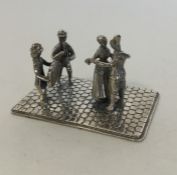 A Continental miniature of dancers on silver cobbl