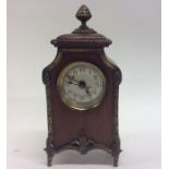 A small Edwardian brass mounted mantle clock decor