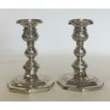A pair of Continental silver dwarf candlesticks at