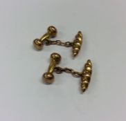 A pair of gold torpedo shaped cufflinks. Approx. 3