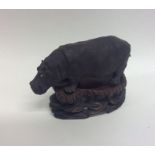 A small Britain's model of a hippopotamus on carve