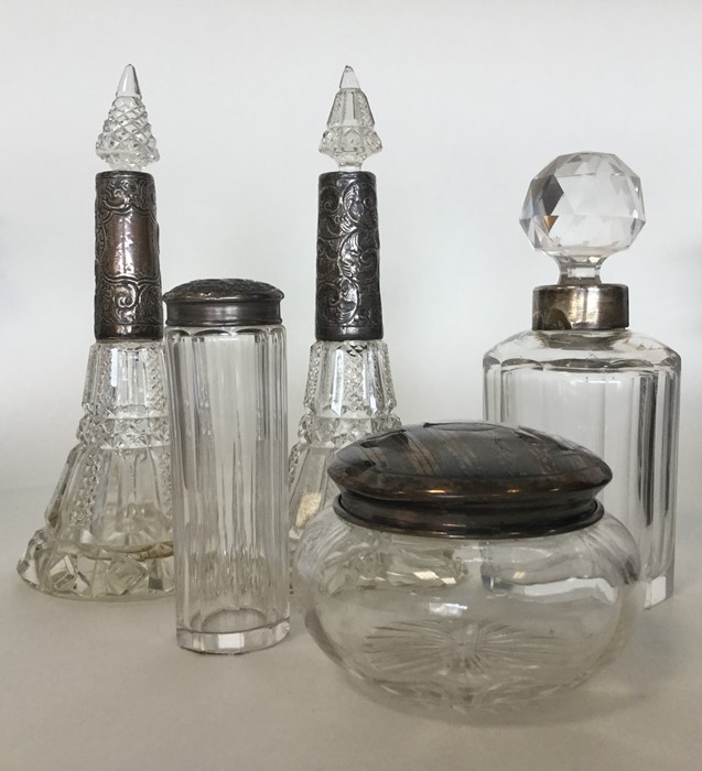 A pair of tall hobnail cut scent bottles together