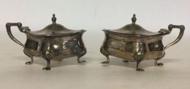 A pair of silver Adams' style mustards with hinged