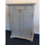 A good painted pine two door cupboard with sloping